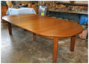 This Gustav Stickley table had been in a fire back in the 1960s. The Experts here at Fischer's restored the table back to its original finish and built 6 new leafs to match the ones lost in the fire